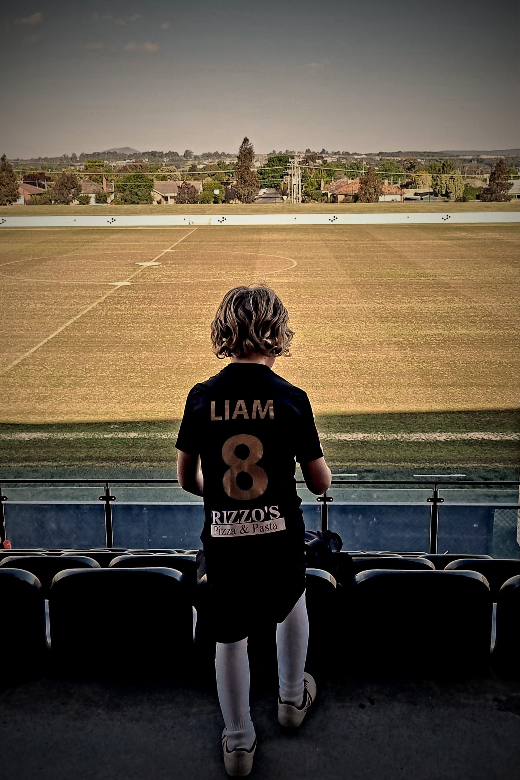 Liam 8 - Looking at field from stands